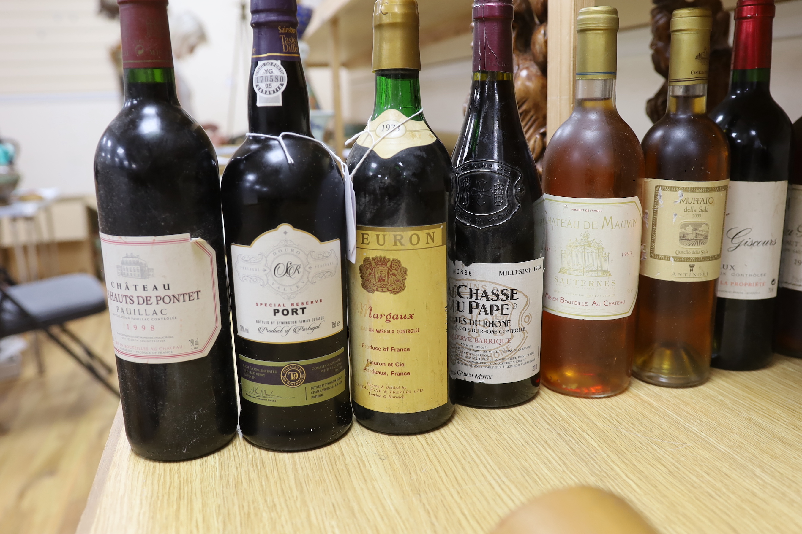 Eight bottles of mixed Cotes du Rhône, Margaux, Pauillac, and Sauternes